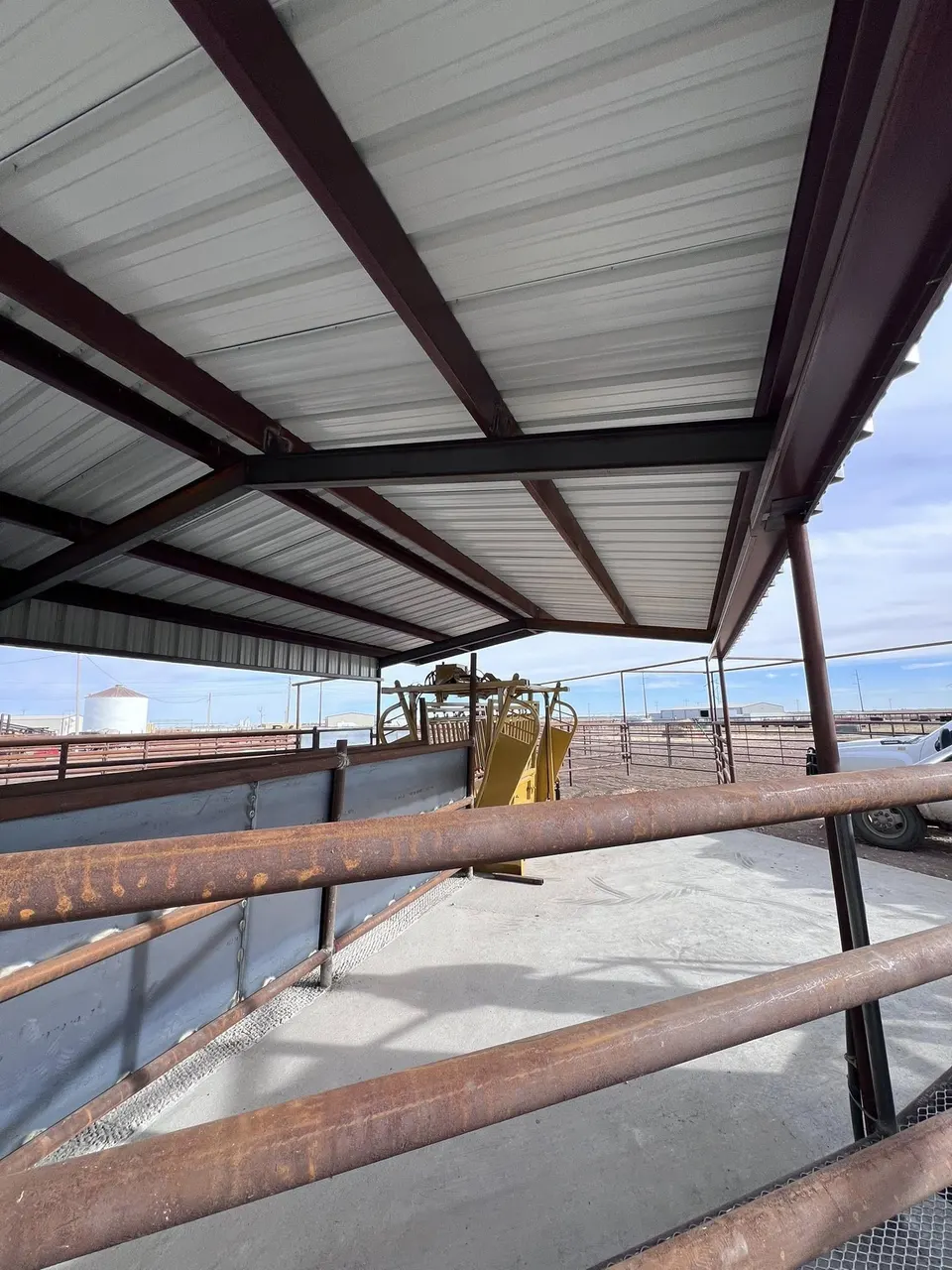 Covered working area with pipe railing on a Texas Panhandle ranch