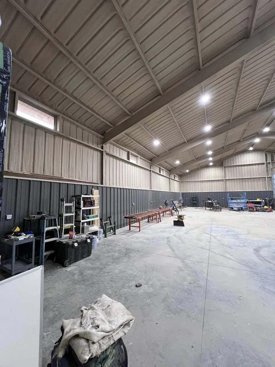 Finished steel shop interior with high ceilings and LED lighting