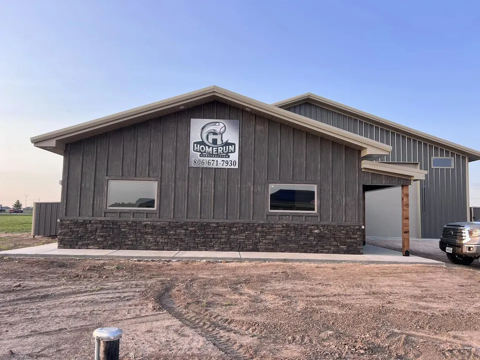 Homerun Fabrication shop building with stone wainscoting and signage in Amarillo, TX